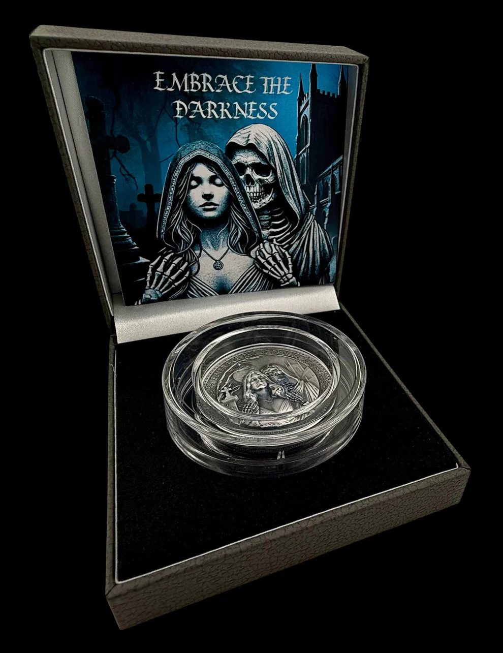Embrace the Darkness coin in its capsule inside a presentation box with printed insert art